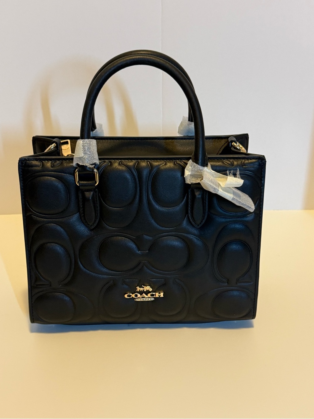 NWT: Maggie small Tote in signature embossed Leather